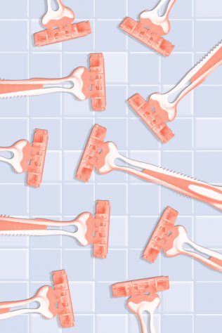 assortment of razors on a bathroom tile background